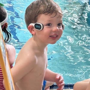 Child with WAVE swimmer wearables